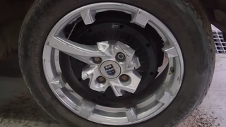 Watch A Man Try To Drive A Car On Wheels With Only A Single Spoke